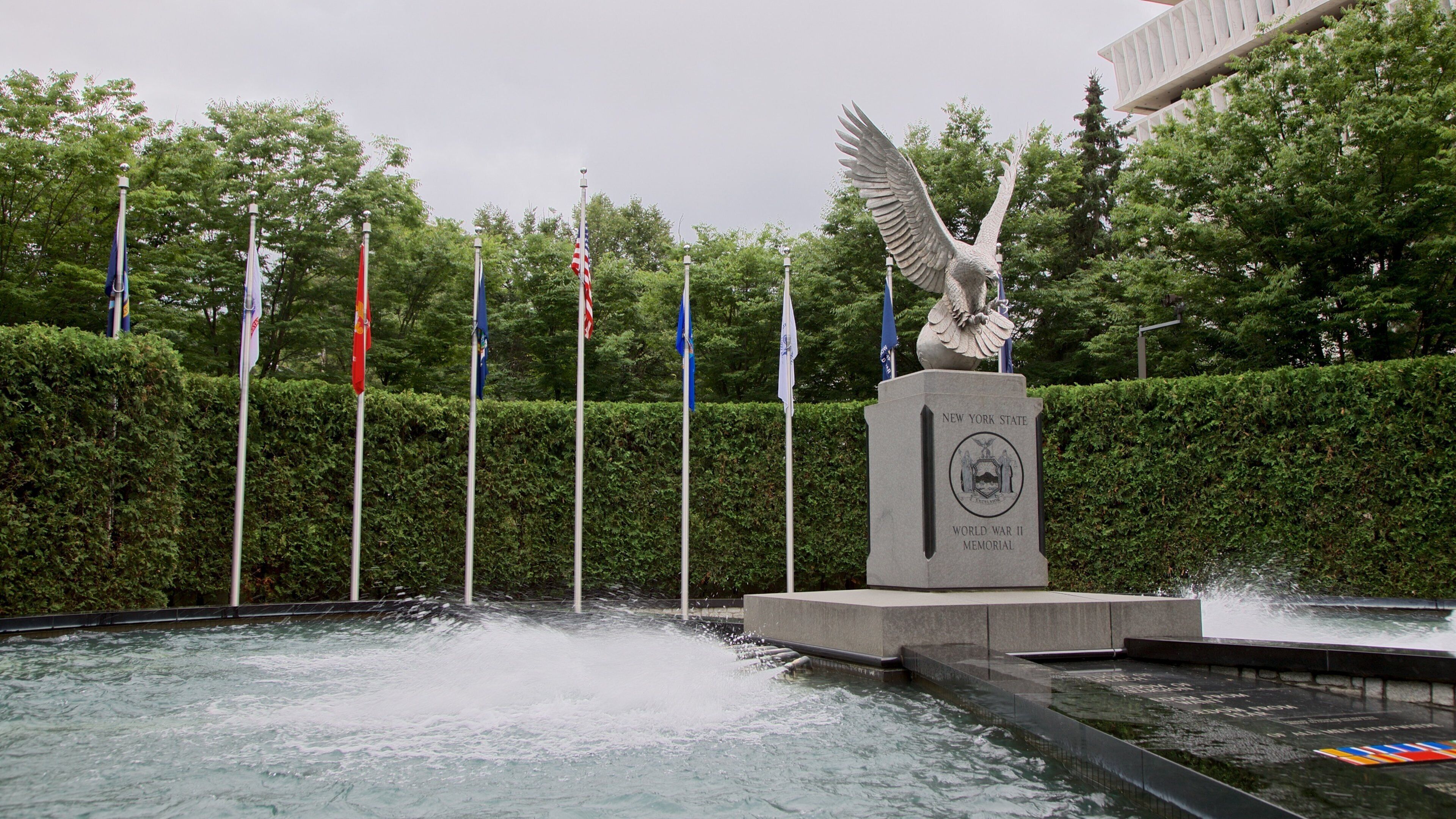 New York State World War II Memorial showing a fountain and a statue or sculpture