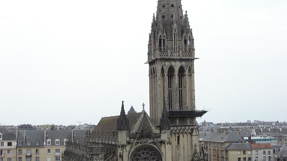 A Gothic cathedral with a tall spire and intricate facade.
