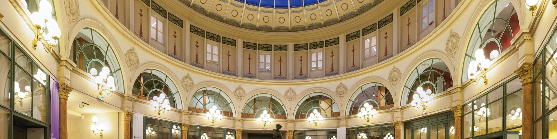 Rotunda of the Galerie Colbert (Colbert Galleria), Paris, 2nd arrondissement. Built in 1826 as a rival to the adjacent and then very popular Vivienne covered passage, it never was as succesful and was almost abandoned until renovation in the 1980s. Bought by French National Library, the galerie is now home to INHA (Institut National de l'Histoire des Arts, Art History National Institute) and INP (Institut National du Patrimoine, Heritage National Institute).