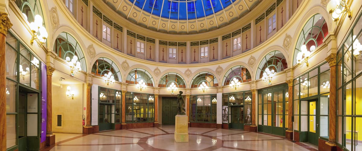 Rotunda of the Galerie Colbert (Colbert Galleria), Paris, 2nd arrondissement. Built in 1826 as a rival to the adjacent and then very popular Vivienne covered passageway, it didn't achieve the same success and was almost abandoned until renovation in the 1980s. Bought by French National Library, the galerie is now home to INHA (Institut National de l'Histoire des Arts, Art History National Institute) and INP (Institut National du Patrimoine, Heritage National Institute).