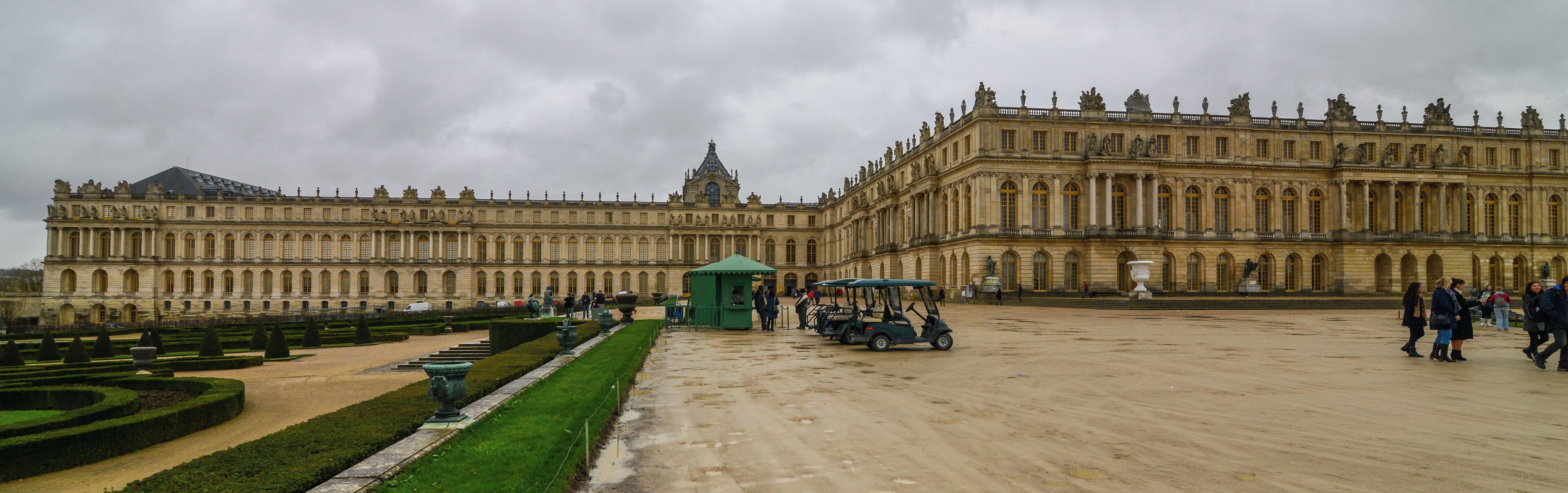 The Palace of Versailles, or simply Versailles, is a royal château in Versailles in the Île-de-France region of France. It is also known as the Château de Versailles. When the château was built, Versailles was a country village; today, however, it is a wealthy suburb of Paris, some 20 kilometres southwest of the French capital. The court of Versailles was the centre of political power in France from 1682, when Louis XIV moved from Paris, until the royal family was forced to return to the capital in October 1789 after the beginning of the French Revolution. Versailles is therefore famous not only as a building, but as a symbol of the system of absolute monarchy of the Ancien Régime. Tourist attraction and art exhibition site The Fifth Republic has enthusiastically promoted the museum as one of France's foremost tourist attractions. The Public Establishment of the Palace, Museum and National Estate of Versailles, a French établissement public à caractère administratif, and Château de Versailles Spectacles organized a Versailles exhibition of the modern art of Jeff Koons in 2008. Six of the works on display came from "the vast private collection of François Pinault, France's wealthiest art collector." In 2008, official Versailles figures stated that nearly five million people visit the château, and 8 to 10 million walk in the gardens, every year [Wikipedia.org]