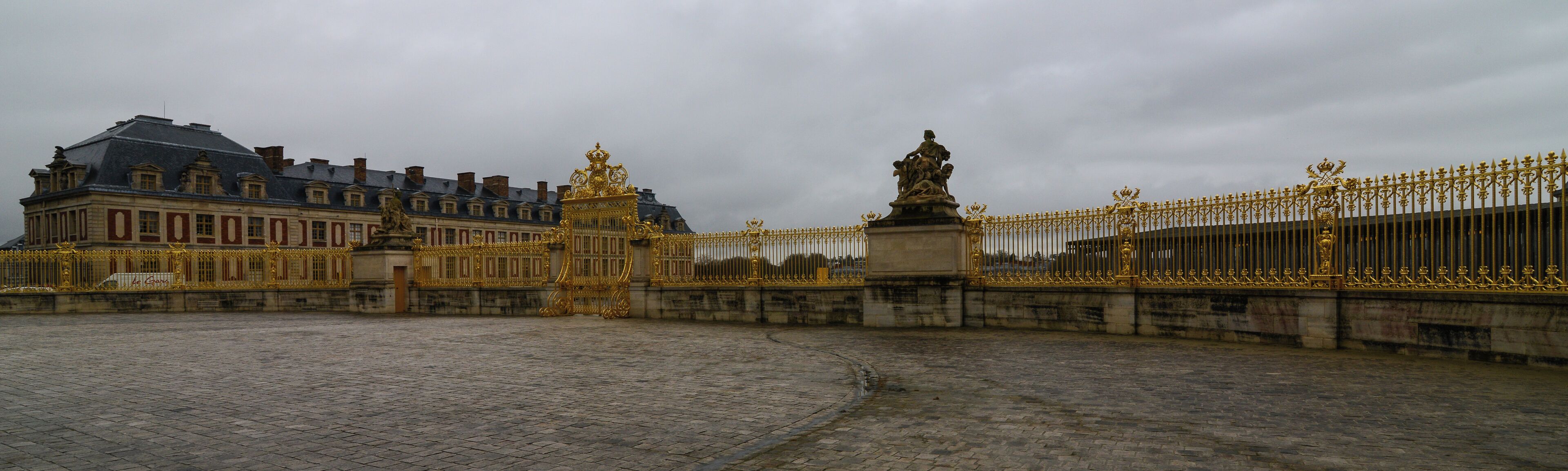 The Palace of Versailles, or simply Versailles, is a royal château in Versailles in the Île-de-France region of France. It is also known as the Château de Versailles. When the château was built, Versailles was a country village; today, however, it is a wealthy suburb of Paris, some 20 kilometres southwest of the French capital. The court of Versailles was the centre of political power in France from 1682, when Louis XIV moved from Paris, until the royal family was forced to return to the capital in October 1789 after the beginning of the French Revolution. Versailles is therefore famous not only as a building, but as a symbol of the system of absolute monarchy of the Ancien Régime. Tourist attraction and art exhibition site The Fifth Republic has enthusiastically promoted the museum as one of France's foremost tourist attractions. The Public Establishment of the Palace, Museum and National Estate of Versailles, a French établissement public à caractère administratif, and Château de Versailles Spectacles organized a Versailles exhibition of the modern art of Jeff Koons in 2008. Six of the works on display came from "the vast private collection of François Pinault, France's wealthiest art collector." In 2008, official Versailles figures stated that nearly five million people visit the château, and 8 to 10 million walk in the gardens, every year [Wikipedia.org]