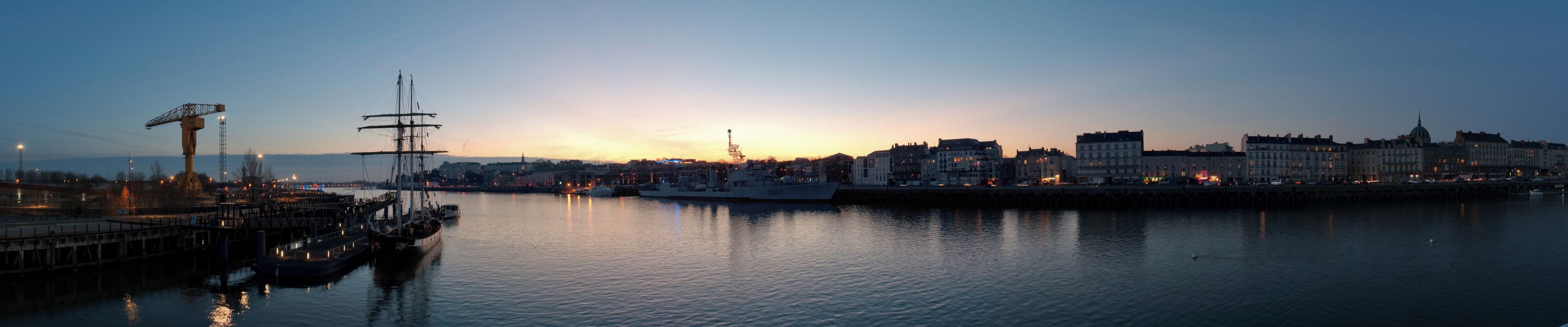 Nantes, the docks (Île de Nantes and Quais de la Fosse) at sunset. The boats are La Boudeuse on the left and the Maillé Brézé on the right.
