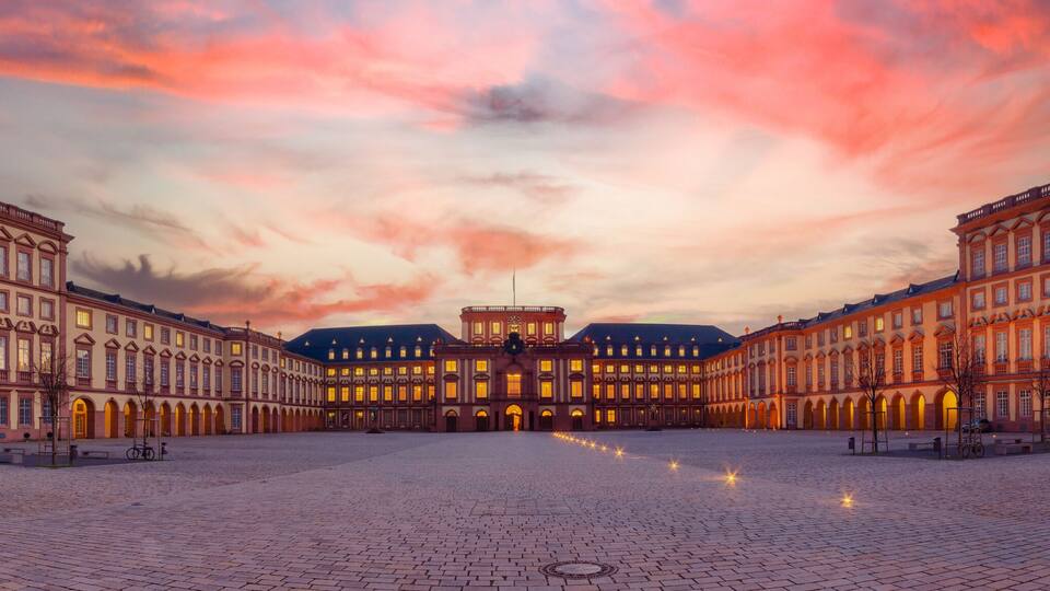 Mannheim, Germany. Panoramic view of the Baroque Palace of Mannheim at sunset. Here are located the University and a Historic Museum. 2013-02-07.