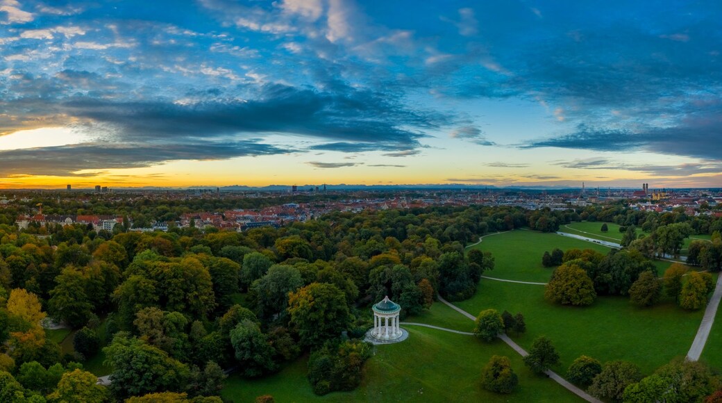 A beautiful start in the day. Sunset over Munichs English Garden as an aerial panorama shot.