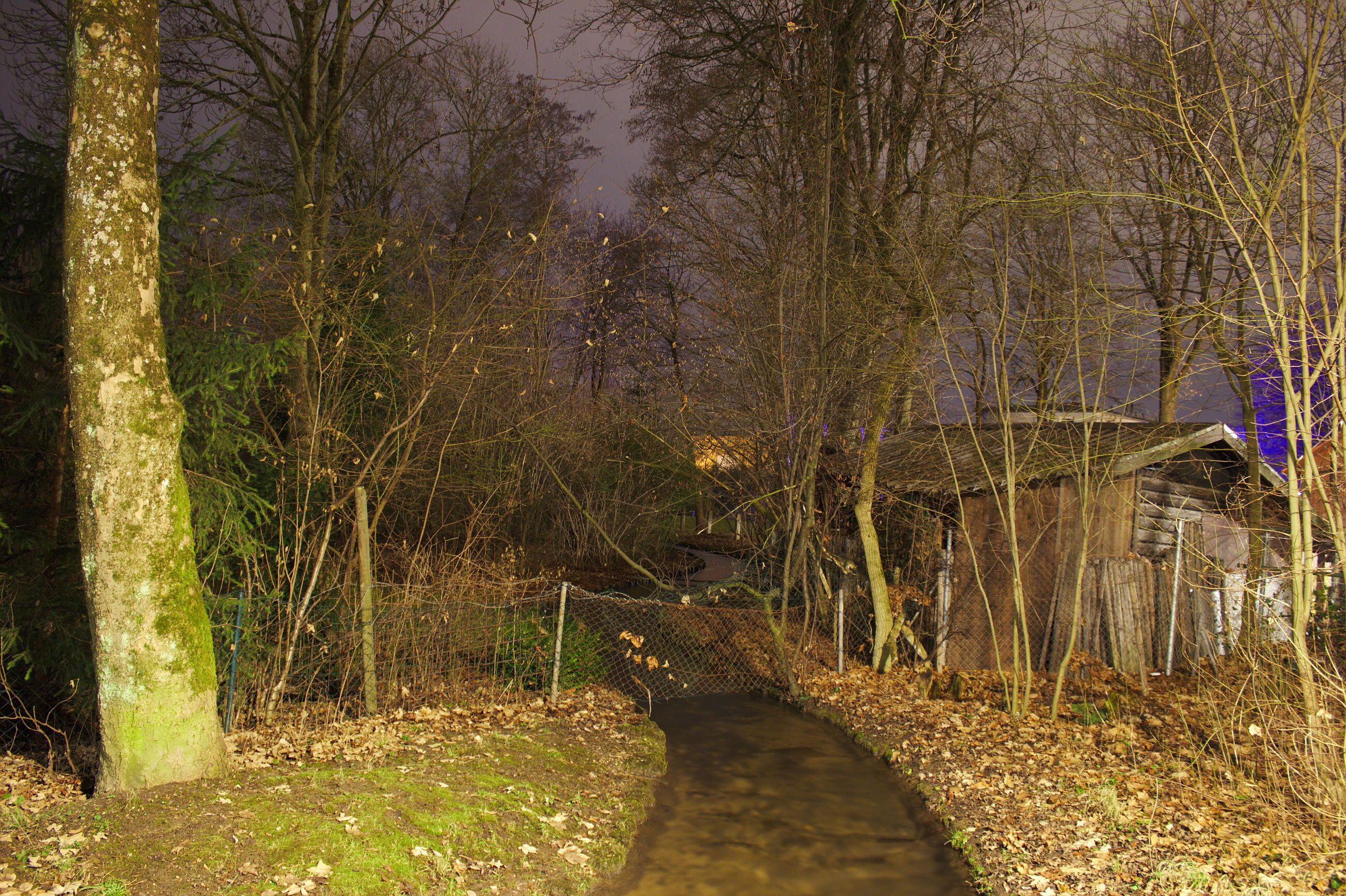 The Hachinger Bach in Perlach, Munich, photographed at night.