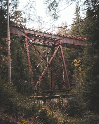 old, little trainbridge made out of metal
not in use anymore
hidden in the forest