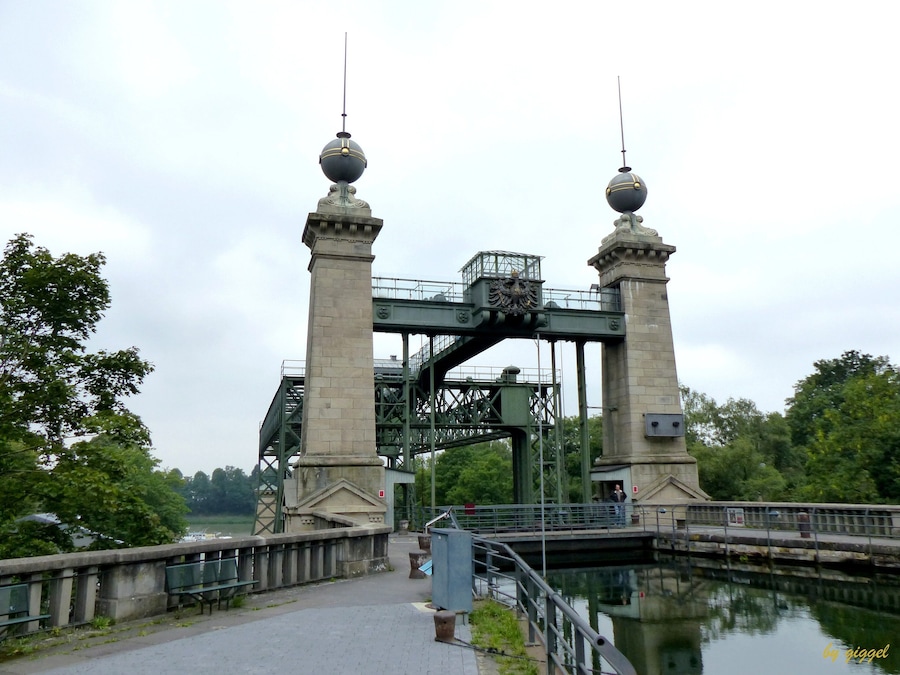 A historic bridge with ornate towers and a central archway.