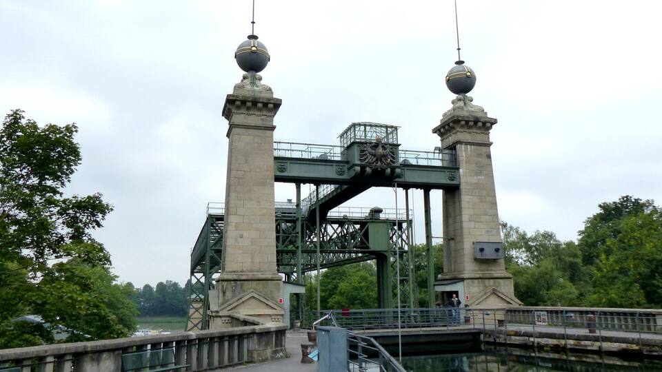 A historic bridge with ornate towers and a central archway.