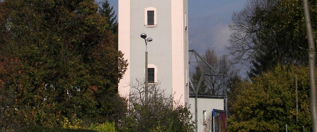A tower with a red roof and a white tower section.