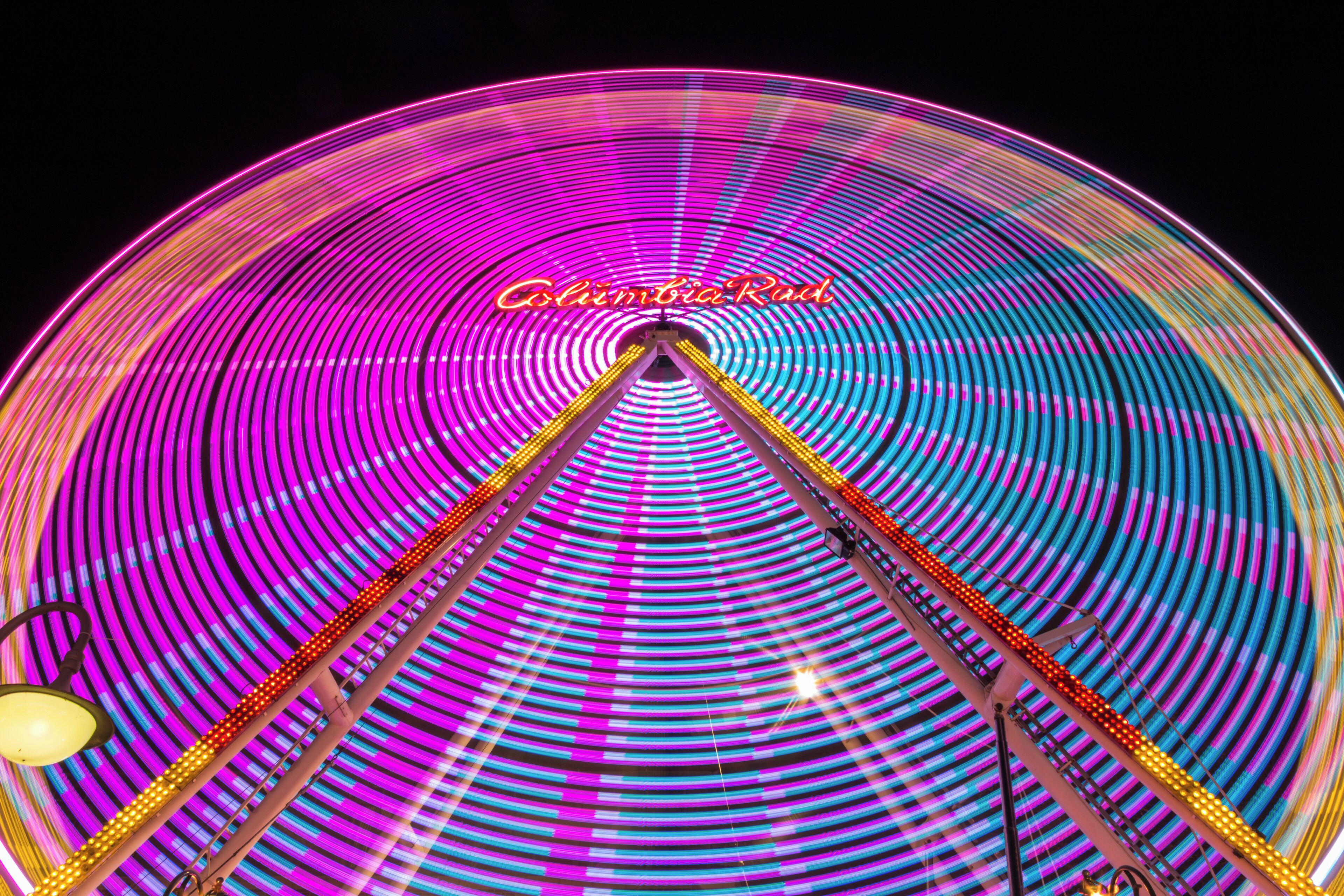 Light traces of a ferris wheel, Viktorkirmes in Dülmen, North Rhine-Westphalia, Germany