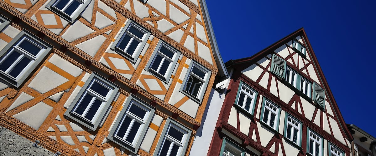 A traditional half-timbered building with a clear blue sky in the background.