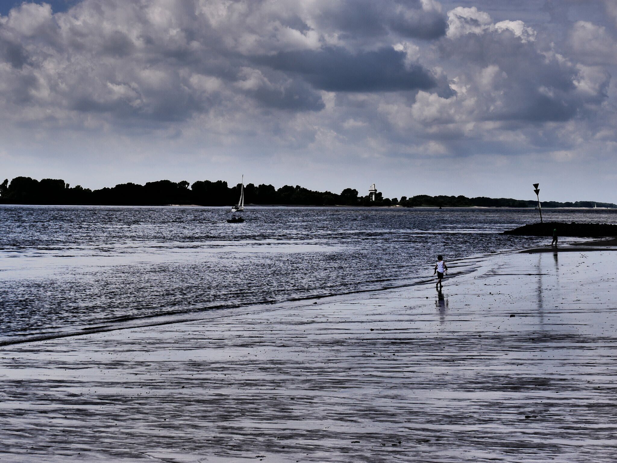 500px provided description: Child playing at the riverbanks [#landscape ,#boat ,#reflection ,#seashore ,#Lowtide ,#Hmaburg]