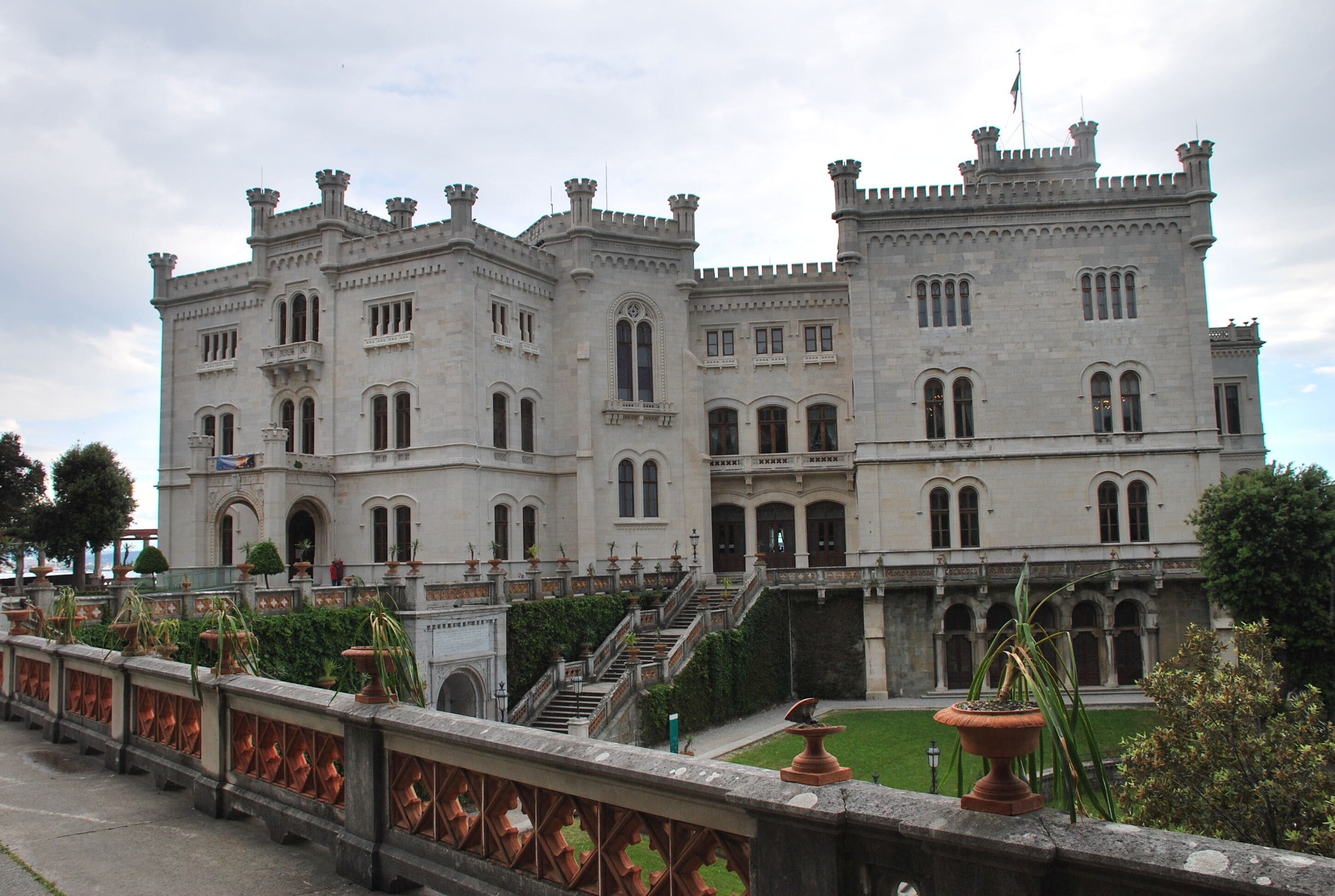 A large, ornate castle with multiple towers and arched windows.