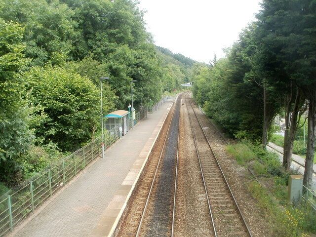 Llanbradach railway station platform 1 viewed from the footbridge. A view north from the footbridge connecting the two platforms, which are not opposite each other. The only passenger facility on this platform is a small shelter, but at least it is enclosed, unlike the one on platform 2.