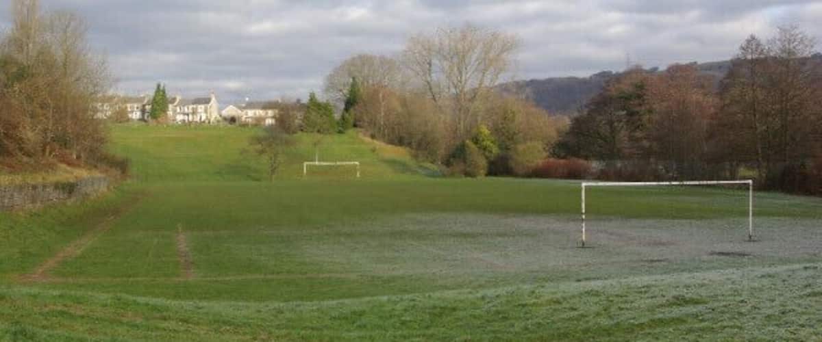Football pitch, Llanbradach Seen from close to the library with houses on The Avenue in the distance. The ground is still frosty at nearly midday.