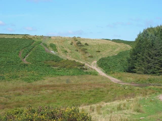 Senghenydd Dyke. The Dyke - the small depression marked by bushes going over the skyline from the centre of the picture was said to have been constructed to mark the boundary of the lands of the lords of Senghenydd. [Anyone who knows more, please add a comment]