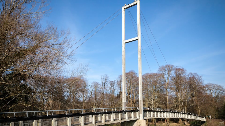 A bridge over the River Taff in Cardiff against a blue sky