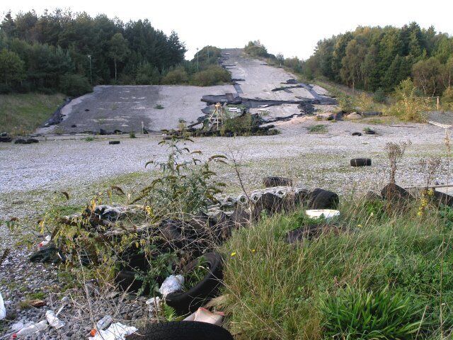 Disused dry ski slope This used to be a popular dry ski slope. It now lies derelict, stripped of its special surface.