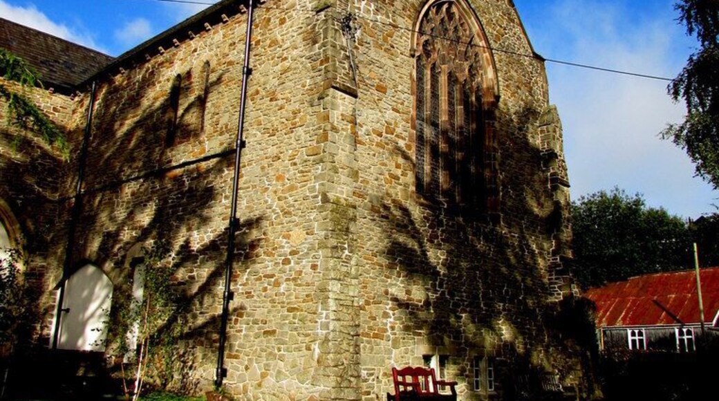 East side of St Paul's Church, Newbridge. Located on the north side of High Street, the Parish Church of St Paul Newbridge is part of the Church in Wales Diocese of Monmouth. The rusty church hall roof is in the background.