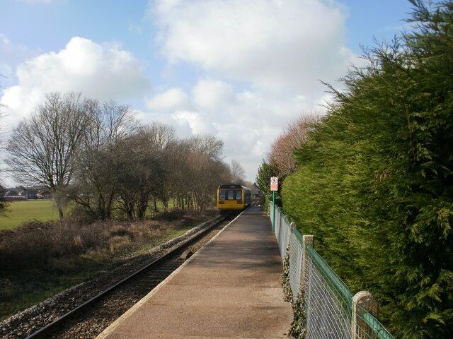 Train leaves Rhiwbina railway station, Cardiff An Arriva Trains Wales train is heading for Whitchurch station, then the end of the line at Coryton.
