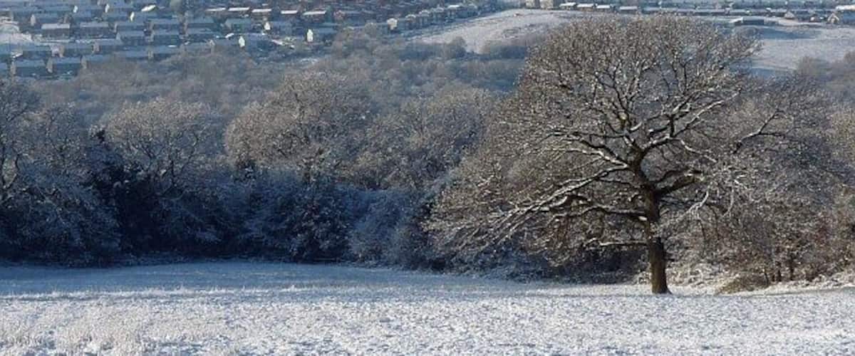 Snowy view across the Rhymney Valley. From 1633376 looking west towards Hengoed.