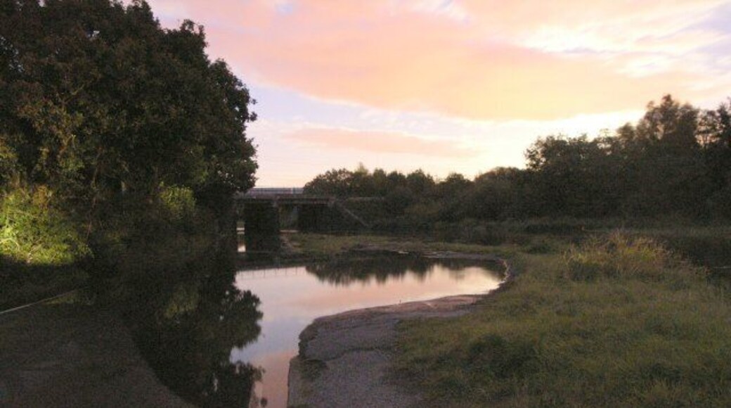 Autumn spring tide floods river Lliw The river Lliw, a tributary of the river Loughor floods within minutes becoming almost impassable. Impossible for cars (though some tried to our amusement) but if you own a Jeep 4X4 just some fun in a day's driving! This happens about 3-4 times a year on high spring tides - it can get a lot higher than this on especially high tides! Picture was taken about 45 minutes after sunset and the light is predominantly moonlight and residual sunlight. The picture is of a submerged road, layby and in the distance the West Wales railway line bridge just in front of the main road bridge.