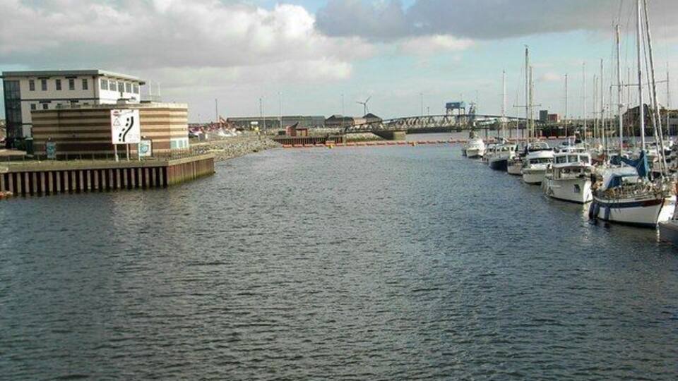 Tawe crossings Looking downstream along the River Tawe. Taken from the sail bridge 357849, towards the former railway bridge which linked the former South Dock with the main Swansea dock complex. The original Swansea Harbour & Improvement Trust soon changed their name to Swansea Harbour Trust. (Much more respectable initials!!!)