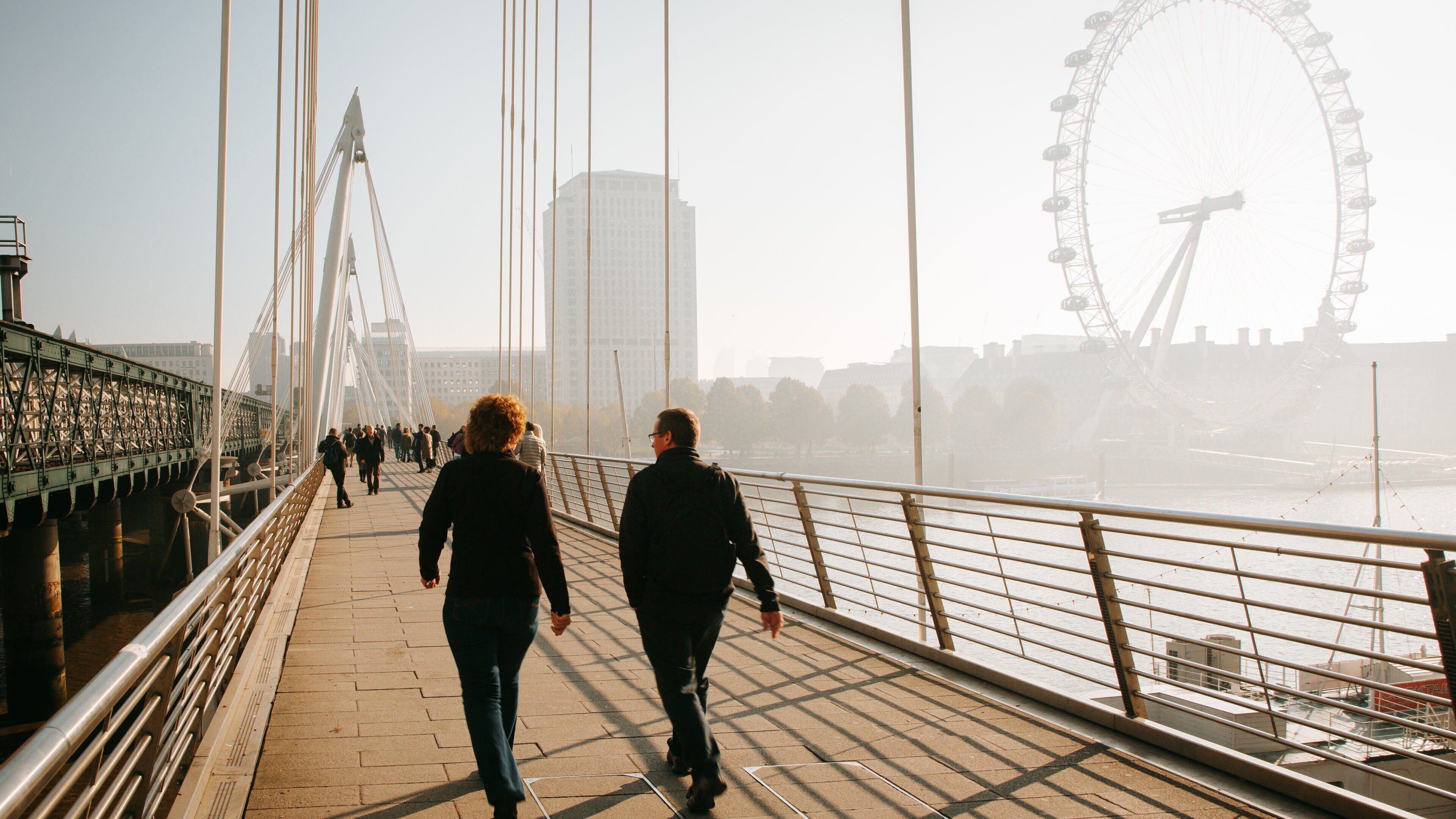 Golden Jubilee Bridges showing a bridge and a sunset as well as a couple