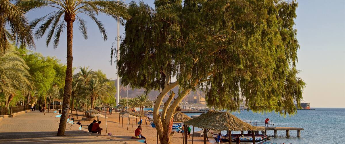 Aqaba showing a beach and general coastal views as well as a small group of people