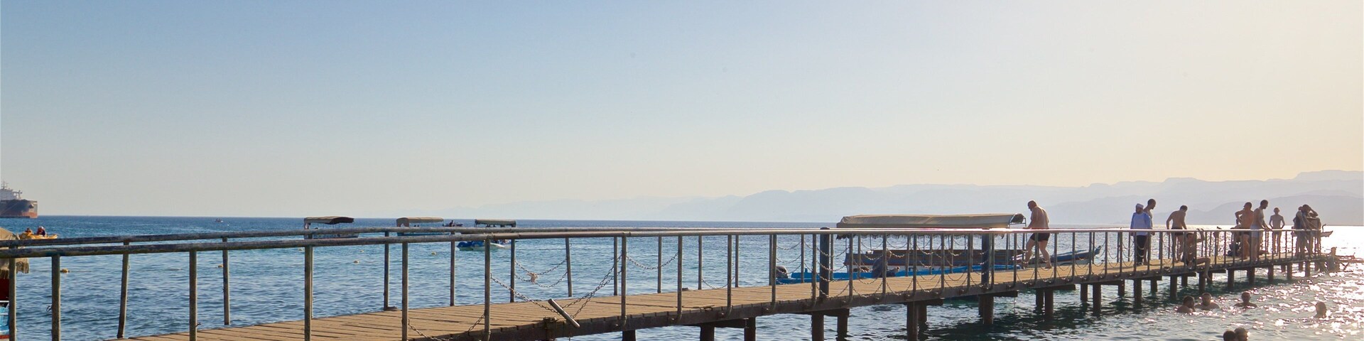 Aqaba showing general coastal views as well as a small group of people