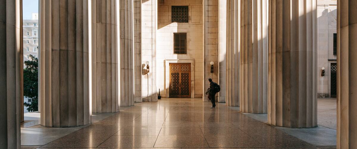 Legislative Plaza which includes heritage architecture as well as an individual male