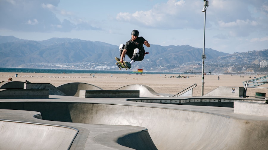 Venice Skate Park showing a sporting event as well as an individual male