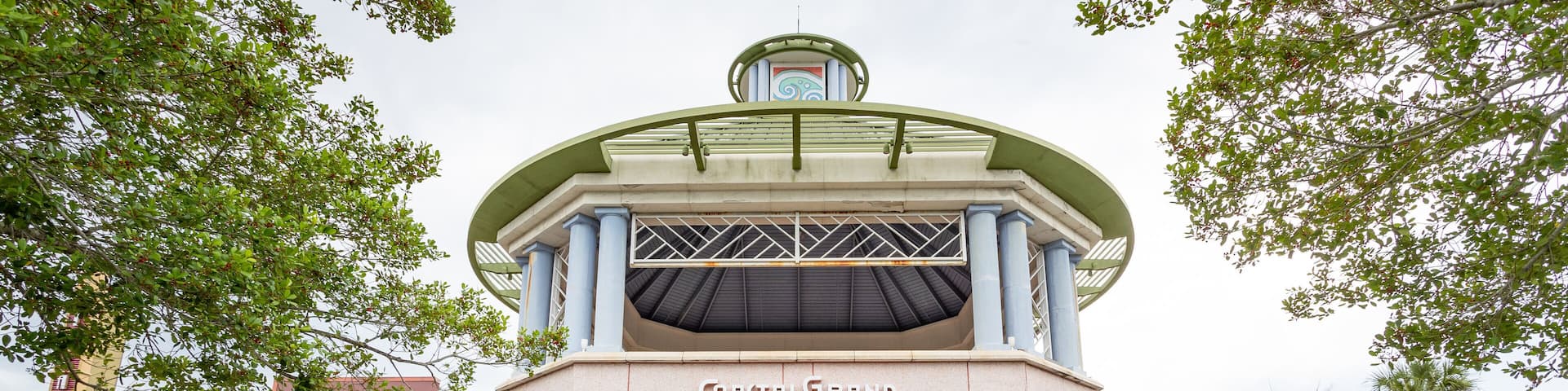 A building with a sign reading "Coastal Grand Myrtle Beach."