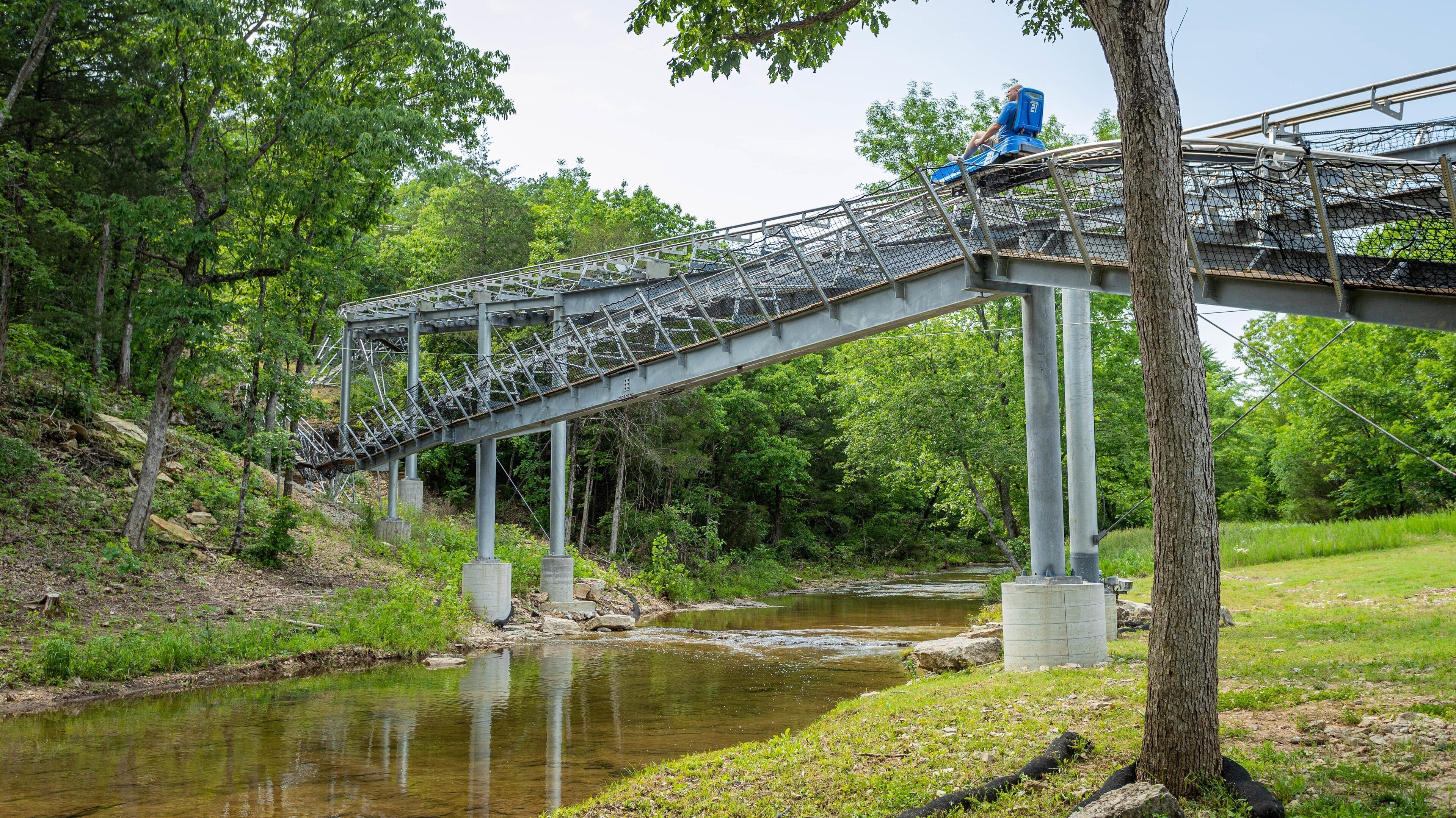 Runaway Mountain Coaster at Branson Mountain Adventure Park featuring a river or creek and a bridge