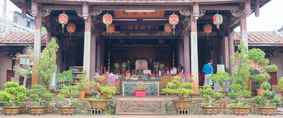 A traditional Chinese temple with ornate architecture, including curved roofs and intricate decorations.