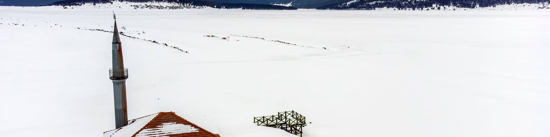 Aerial shot with drone, in winter snow landscape, Bolu - Seben - Turkey, Seben mosque view