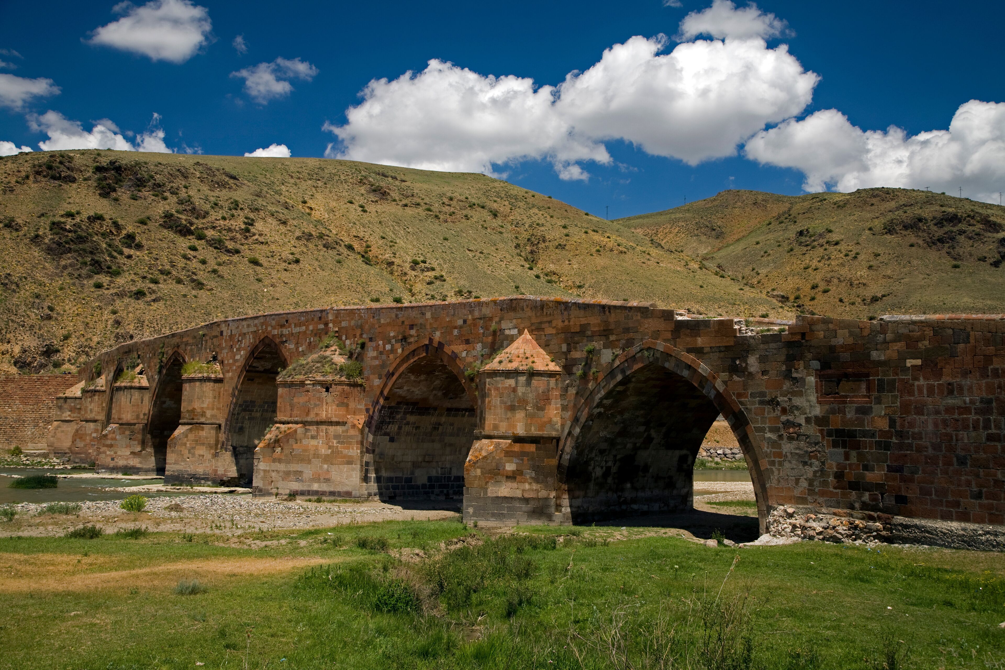Historical Cobandere Bridge built in 1298 on Aras River, Kars Turkey.