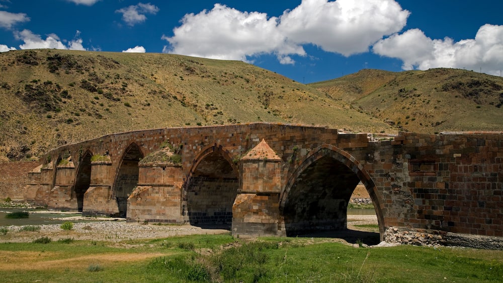 Historical Cobandere Bridge built in 1298 on Aras River, Kars Turkey.
