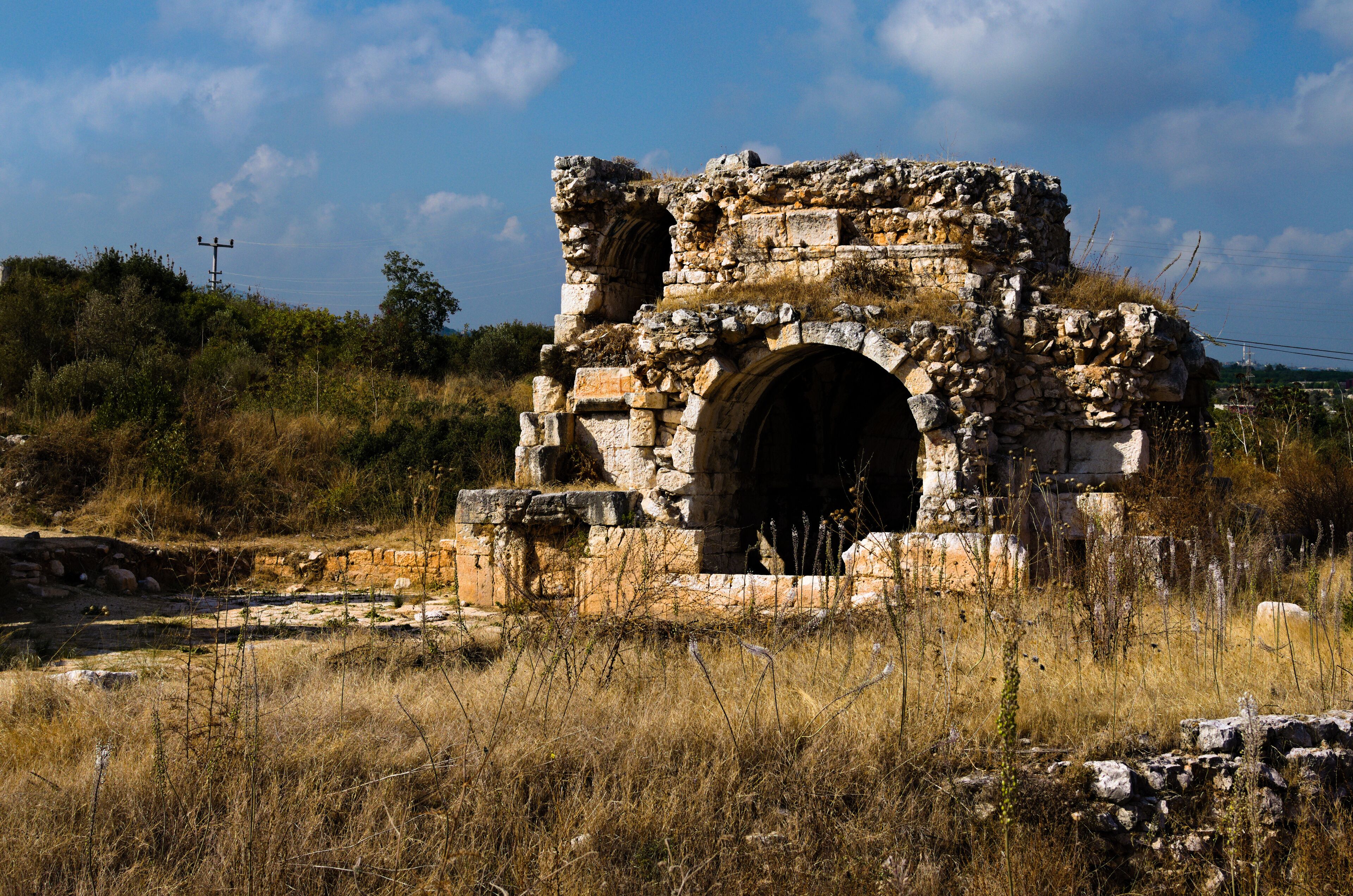 View ruins of ancient stone wall. Ruins of roman villa in Akkale (literally "white castle"), Akdeniz,Turkey. It was a port administration complex of the Roman Empire built in the 4th century