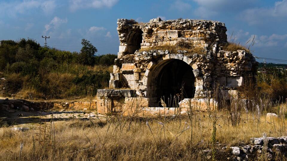 View ruins of ancient stone wall. Ruins of roman villa in Akkale (literally "white castle"), Akdeniz,Turkey. It was a port administration complex of the Roman Empire built in the 4th century