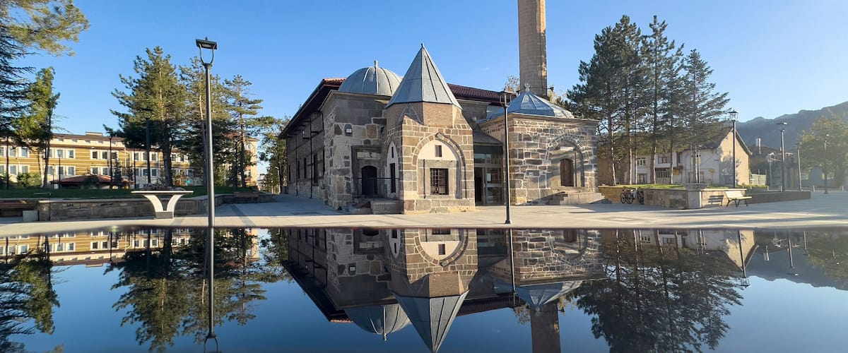 Reflections and texture of the centuries-old historical mosque and minaret