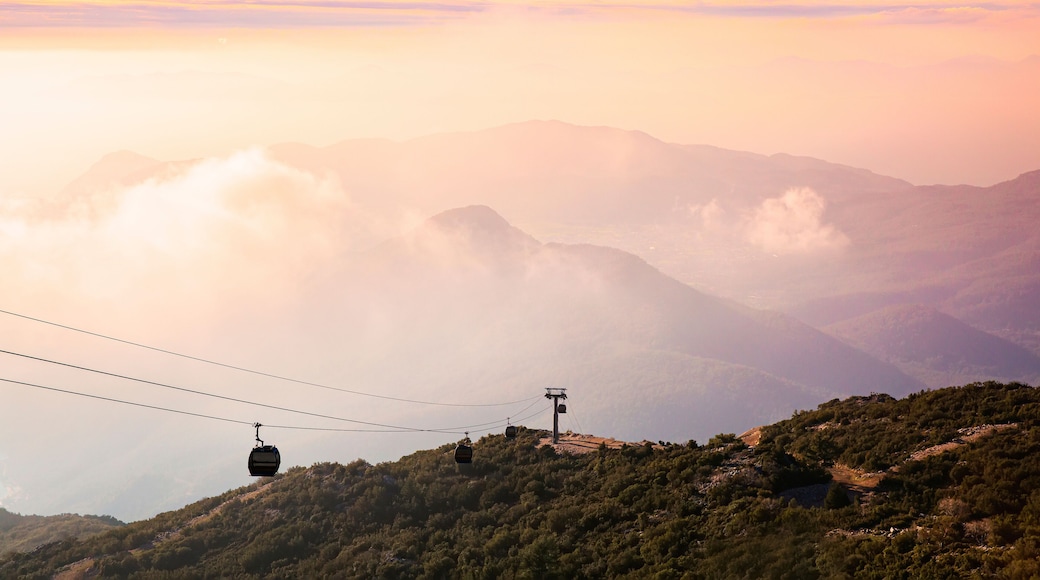 Beautiful cableway on a background of sunset landscape, mountains and sea. Cabin cableway. Funicular to Mount Babadag, Türkiye.