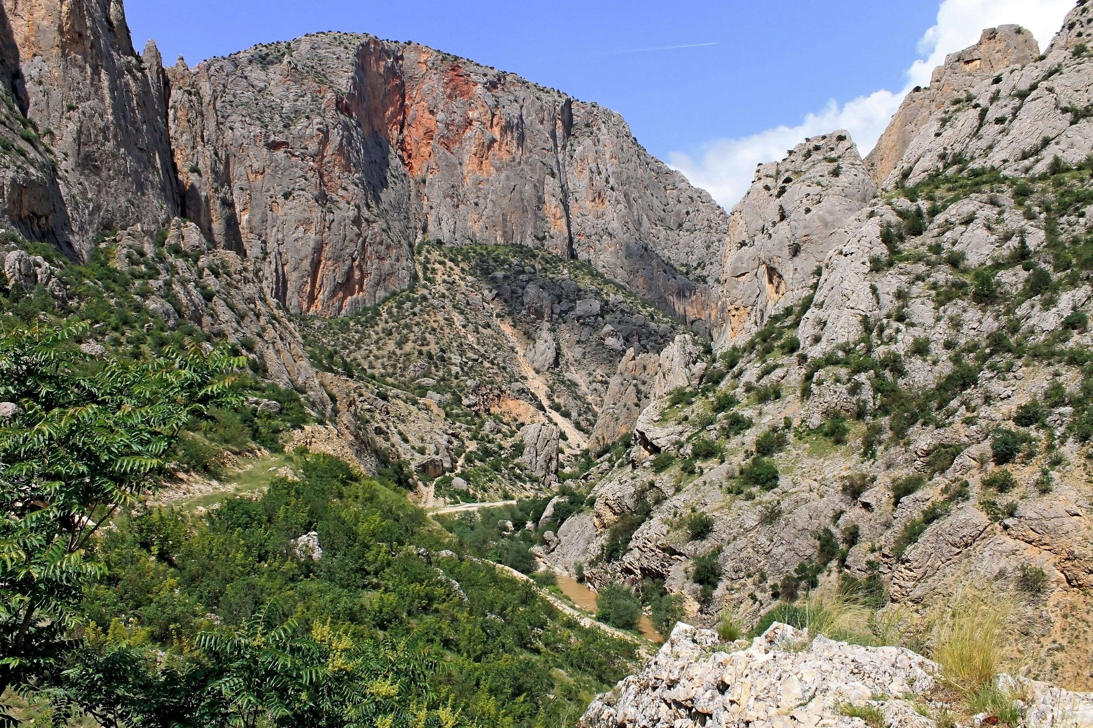 Kazankaya Canyon in Yozgat region in Turkey. Breathtaking view of the high red mountains of the gorge. Travel theme.