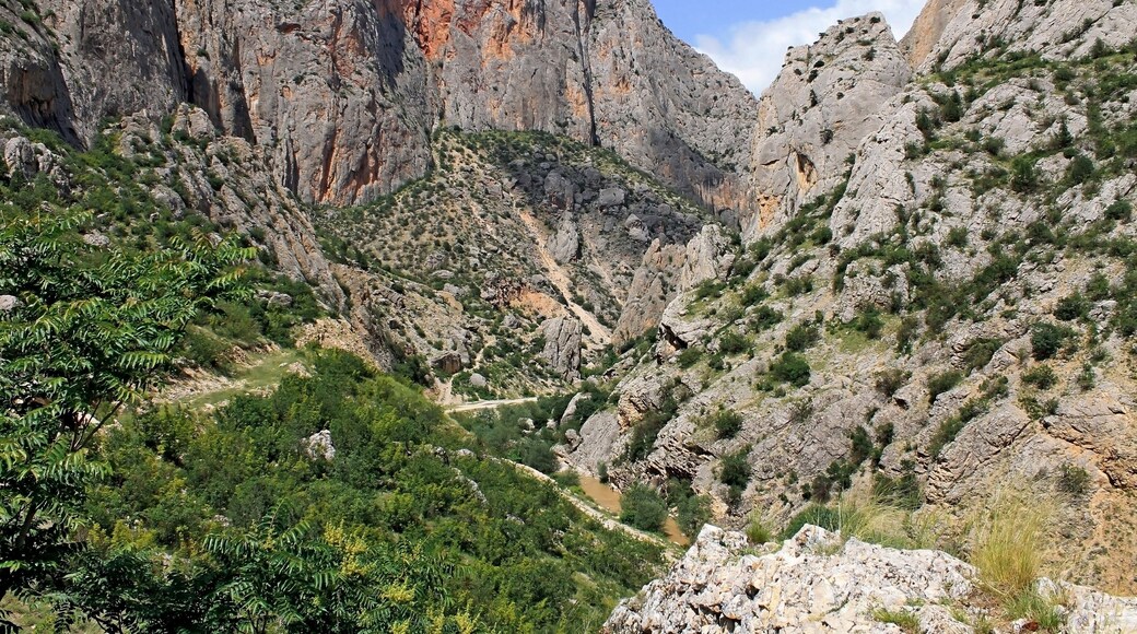 Kazankaya Canyon in Yozgat region in Turkey. Breathtaking view of the high red mountains of the gorge. Travel theme.