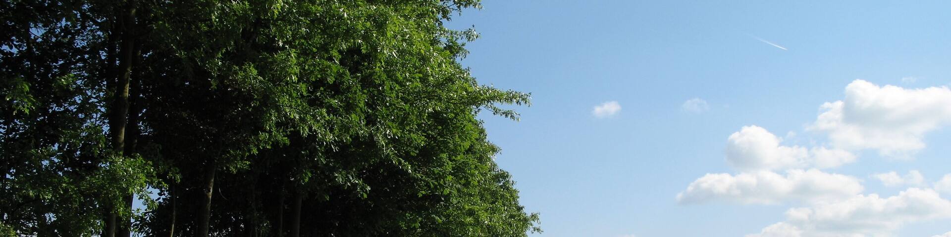 The countryside of the Ingooigem province of West Flanders, Belgium. On the right are the slopes of Tiegemberg Hill.