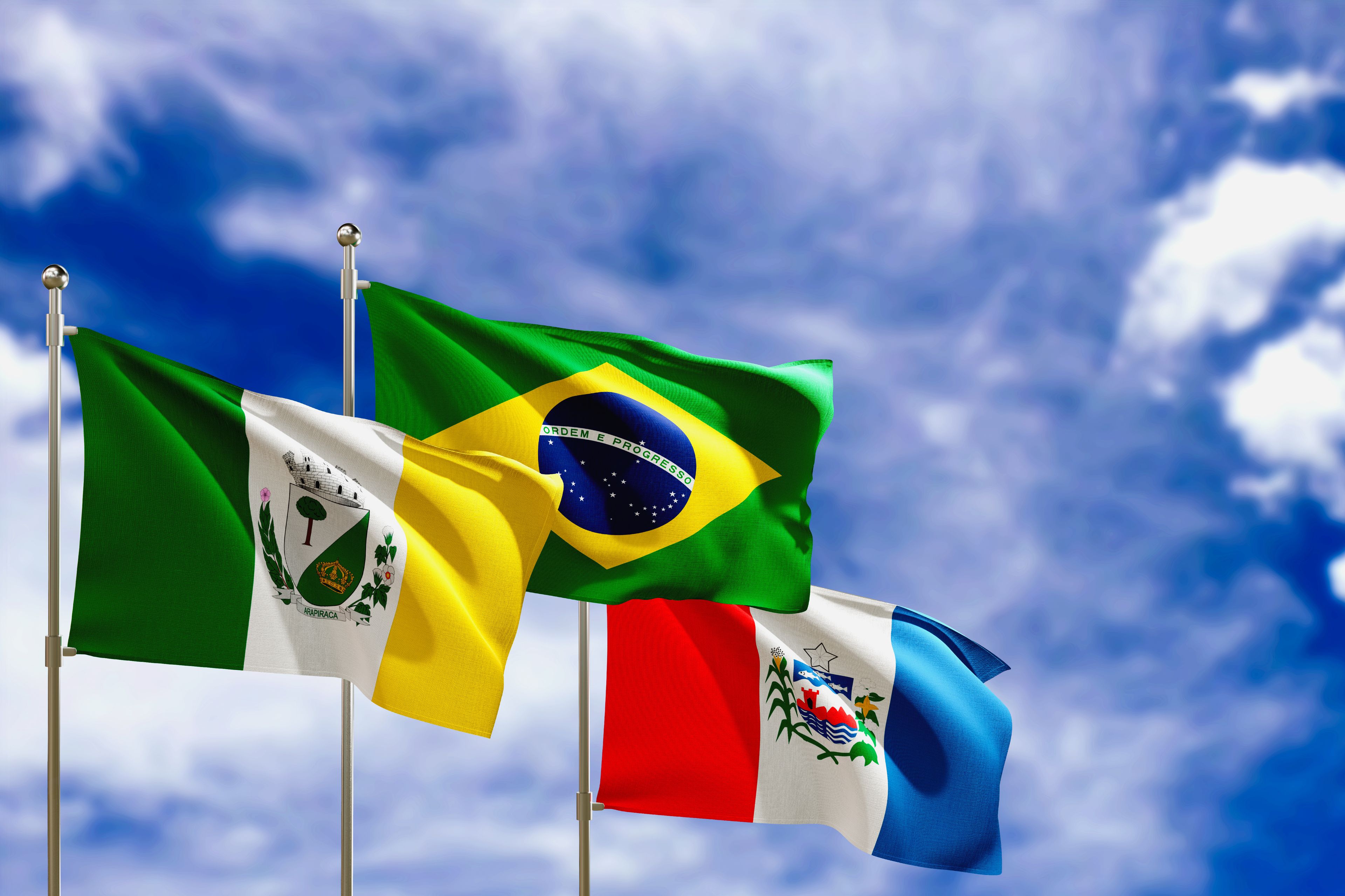 Official flags of the country Brazil, state of Alagoas and city of Arapiraca. Swaying in the wind under the blue sky. 3d rendering