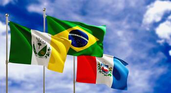 Official flags of the country Brazil, state of Alagoas and city of Arapiraca. Swaying in the wind under the blue sky. 3d rendering