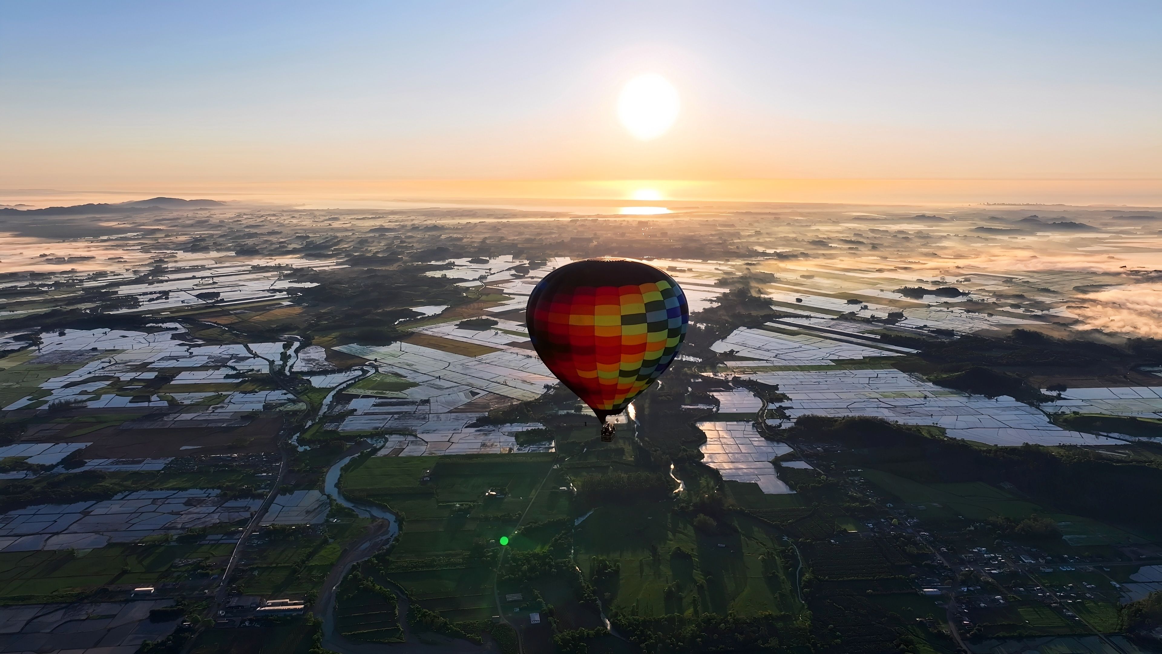 Scenic Balloon In Praia Grande Santa Catarina Brazil. Bright Colorful Hot Air Balloon Is Floating Over A Green Countryside. Sunset Coast Sky Clouds City Beach Travel. Praia Grande Santa Catarina.