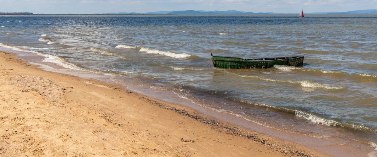 Beach with waves and boats